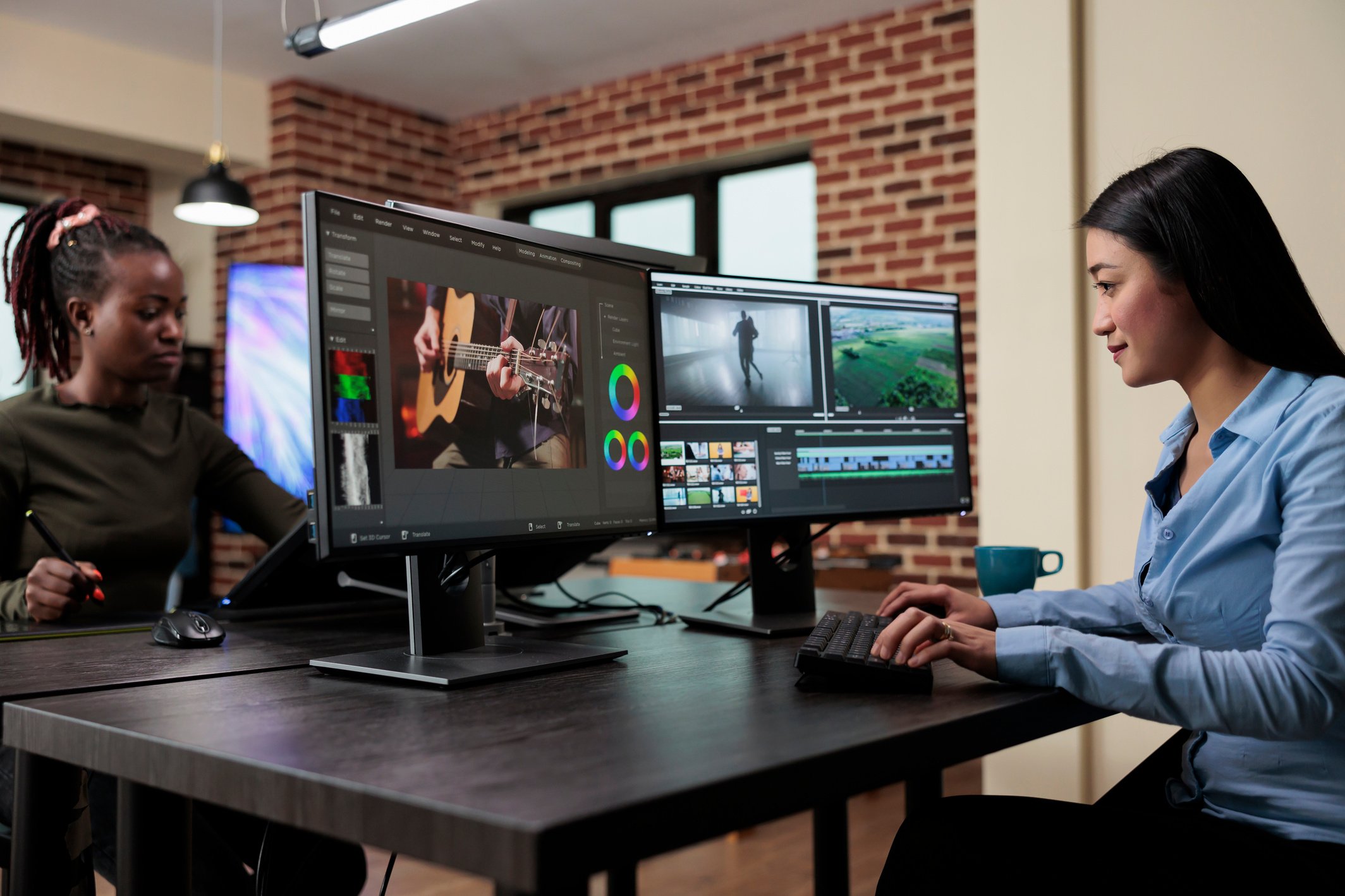 Creative agency professional video editor sitting at desk while using specialized software